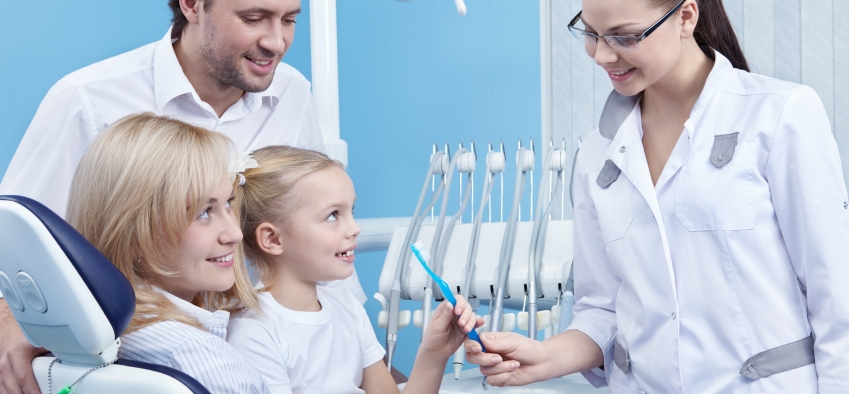 female dentist and family