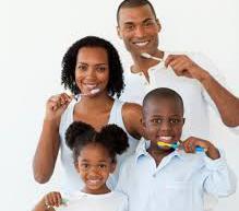 family brushing teeth